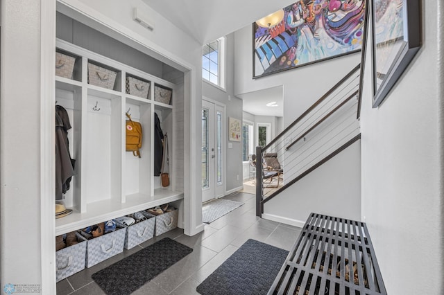 122 15th Ave E, Fargo, ND 58078 - mudroom with dark tile patterned floors and a towering ceiling