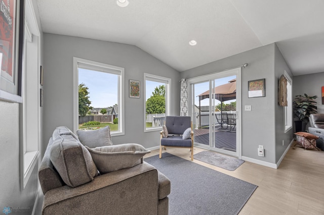 122 15th Ave E, Fargo, ND 58078 - living area featuring lofted ceiling, light wood-style flooring, and recessed lighting