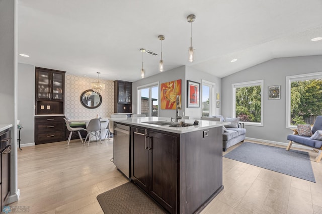 122 15th Ave E, Fargo, ND 58078 - kitchen featuring stainless steel dishwasher, open floor plan, a chandelier, plenty of natural light, and vaulted ceiling