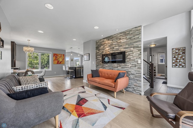 122 15th Ave E, Fargo, ND 58078 - living area with wood finished floors, recessed lighting, stairway, and a chandelier
