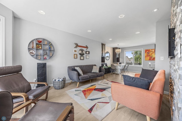122 15th Ave E, Fargo, ND 58078 - living area featuring a chandelier, recessed lighting, and light wood-style floors