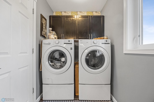 122 15th Ave E, Fargo, ND 58078 - washroom featuring cabinet space and washing machine and dryer