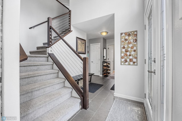 122 15th Ave E, Fargo, ND 58078 - foyer featuring stairway and tile patterned floors