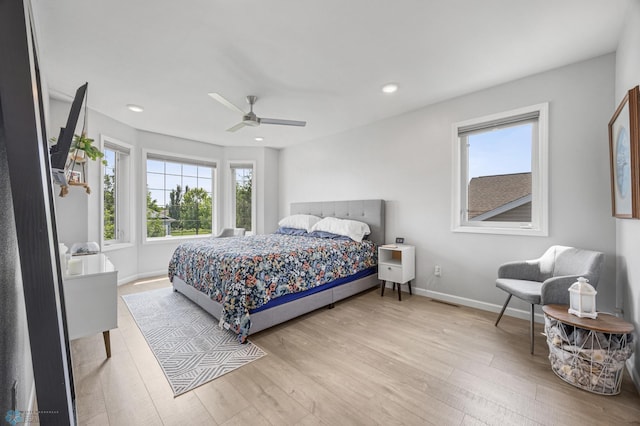 122 15th Ave E, Fargo, ND 58078 - bedroom featuring multiple windows, wood finished floors, ceiling fan, and recessed lighting