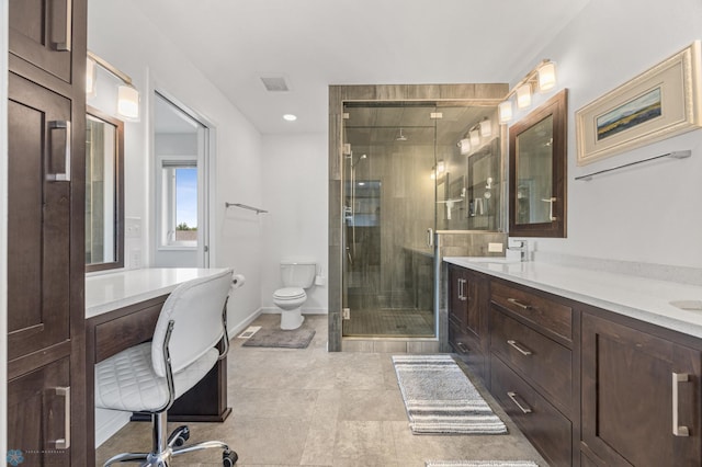 122 15th Ave E, Fargo, ND 58078 - bathroom featuring double vanity, a shower stall, tile patterned floors, and recessed lighting
