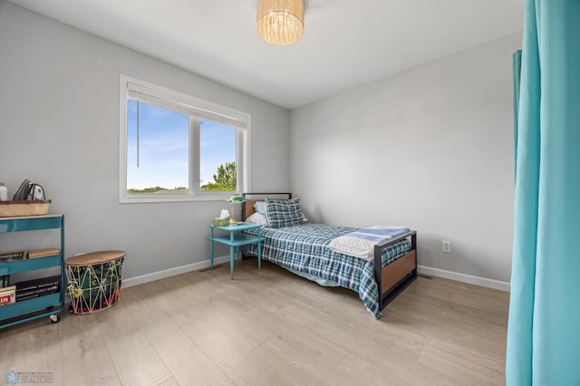 122 15th Ave E, Fargo, ND 58078 - bedroom with wood finished floors and baseboards