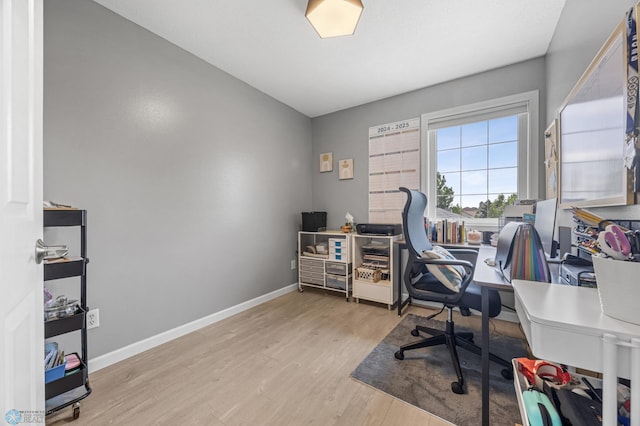 122 15th Ave E, Fargo, ND 58078 - office area featuring wood finished floors and baseboards