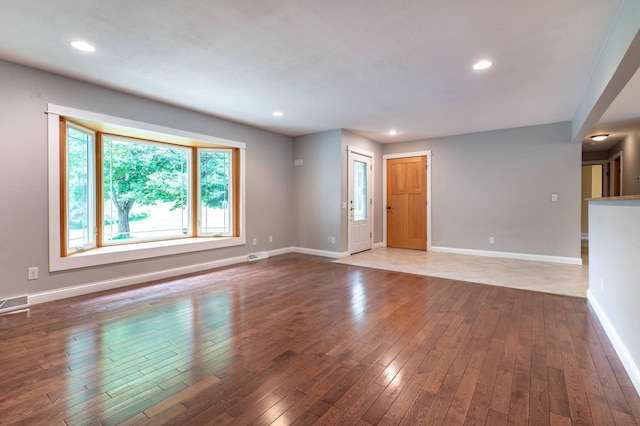 1430 Hoot Lake Dr, Fergus Falls, MN 56537 - unfurnished living room featuring hardwood / wood-style floors and recessed lighting
