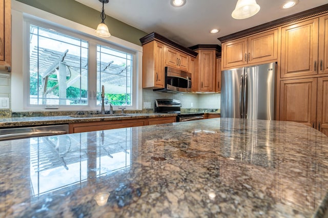 1430 Hoot Lake Dr, Fergus Falls, MN 56537 - kitchen with appliances with stainless steel finishes, dark stone countertops, decorative backsplash, decorative light fixtures, and recessed lighting