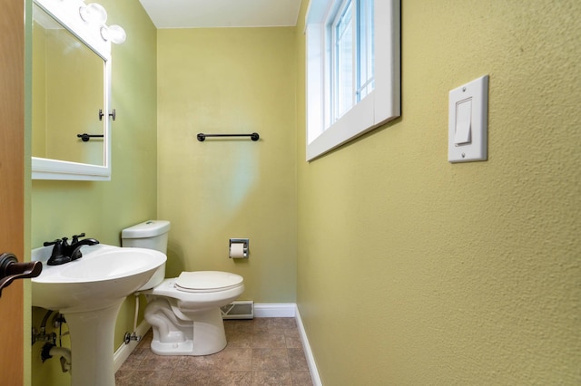 1430 Hoot Lake Dr, Fergus Falls, MN 56537 - bathroom with baseboards and toilet