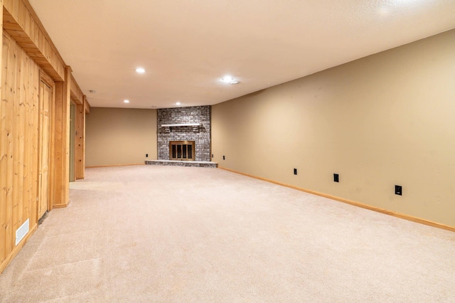 1430 Hoot Lake Dr, Fergus Falls, MN 56537 - unfurnished living room featuring light colored carpet, recessed lighting, and a brick fireplace