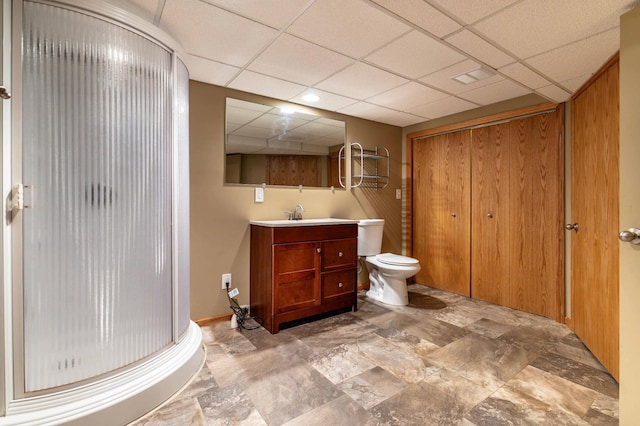 1430 Hoot Lake Dr, Fergus Falls, MN 56537 - bathroom featuring a shower stall, a paneled ceiling, vanity, and stone finish floors