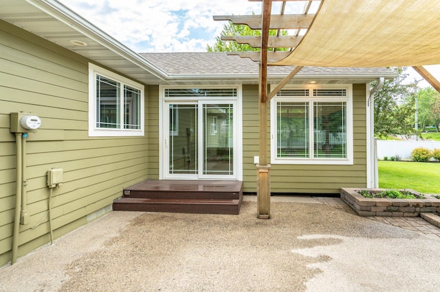 1430 Hoot Lake Dr, Fergus Falls, MN 56537 - doorway to property featuring a shingled roof, a pergola, and a patio area