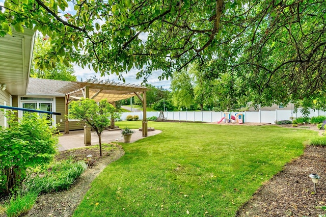 1430 Hoot Lake Dr, Fergus Falls, MN 56537 - fenced backyard featuring a playground, a pergola, and a patio