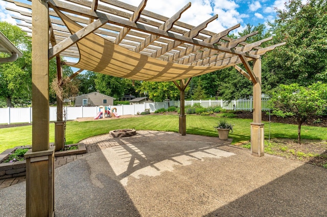 1430 Hoot Lake Dr, Fergus Falls, MN 56537 - fenced backyard featuring a playground, a patio, a pergola, and a fire pit
