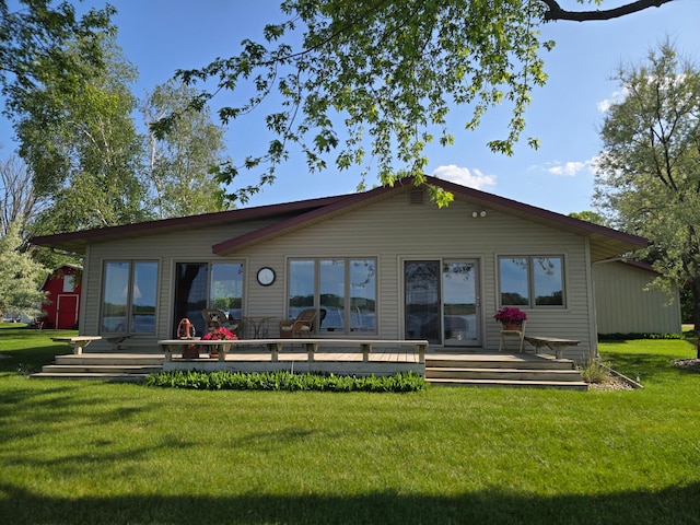 36185 Rose Lake Rd, Hobart Twp, MN 56544 - rear view of property featuring a wooden deck and a yard