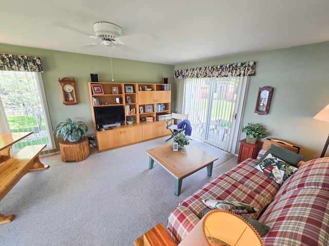 36185 Rose Lake Rd, Hobart Twp, MN 56544 - living room featuring carpet flooring, healthy amount of natural light, and a ceiling fan