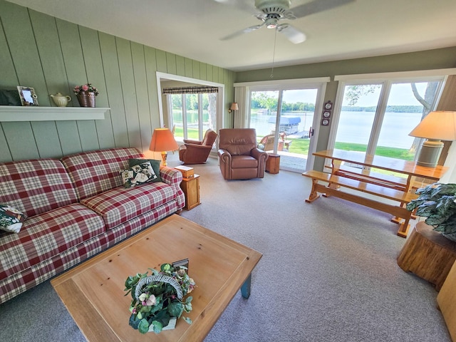 36185 Rose Lake Rd, Hobart Twp, MN 56544 - living area featuring carpet flooring, a water view, and a ceiling fan