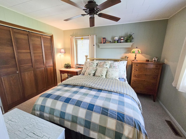 36185 Rose Lake Rd, Hobart Twp, MN 56544 - carpeted bedroom featuring a closet, a ceiling fan, and wood walls
