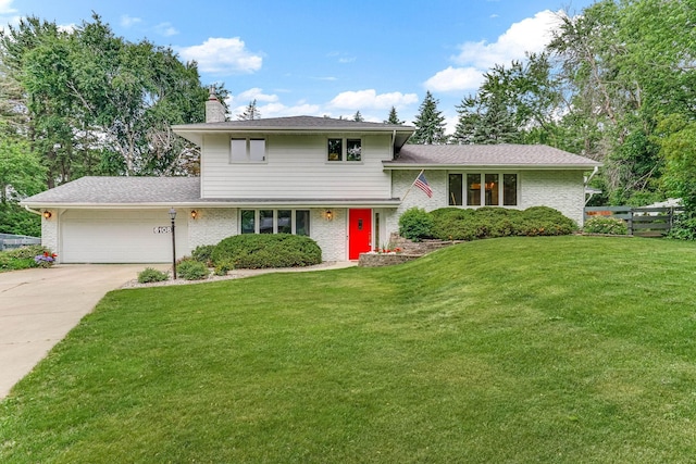 6108 Birchwood Rd, Woodbury, MN 55125 - tri-level home featuring a garage, a chimney, driveway, and brick siding