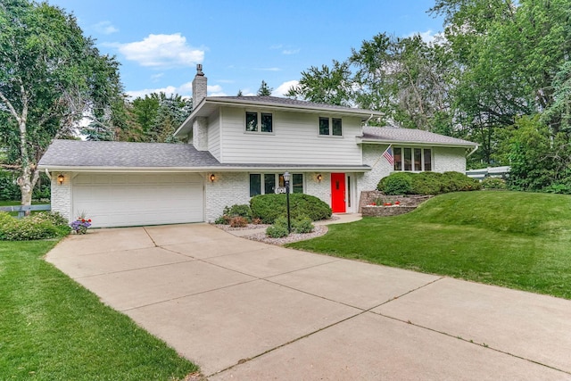 6108 Birchwood Rd, Woodbury, MN 55125 - split level home with an attached garage, driveway, a front lawn, a chimney, and brick siding