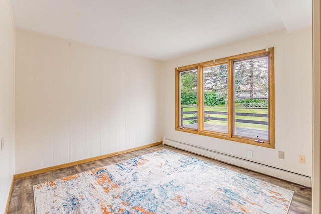 6108 Birchwood Rd, Woodbury, MN 55125 - spare room featuring baseboard heating and wood finished floors