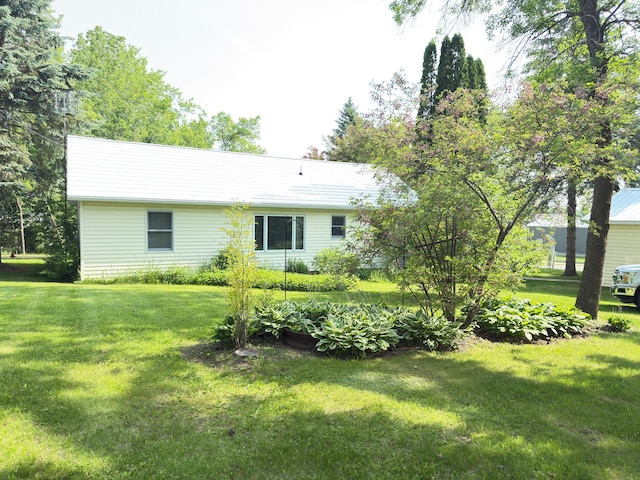 301 Maple St W, Frederic, WI 54837 - back of house featuring a lawn