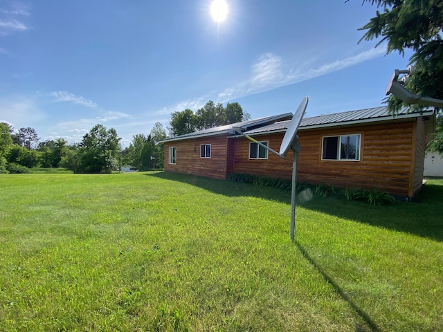 3653 Front St, Barnum, MN 55707 - view of side of property with a lawn and a metal roof
