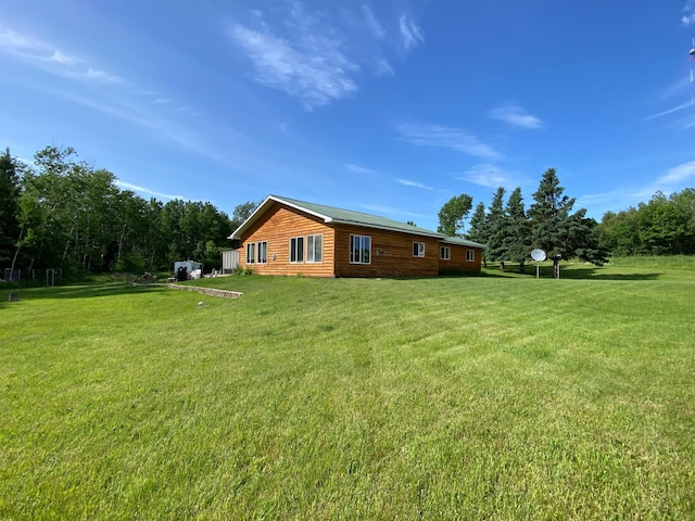 3653 Front St, Barnum, MN 55707 - back of house featuring a lawn and faux log siding