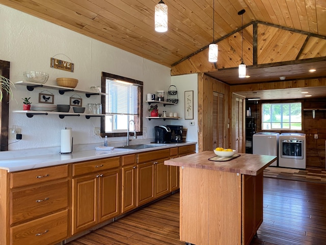 3653 Front St, Barnum, MN 55707 - kitchen featuring open shelves, butcher block countertops, washing machine and dryer, lofted ceiling, and dark wood-style floors