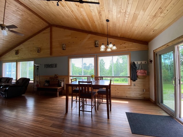 3653 Front St, Barnum, MN 55707 - dining space with wooden ceiling, wooden walls, vaulted ceiling, healthy amount of natural light, and wood-type flooring