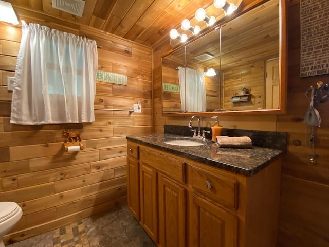 3653 Front St, Barnum, MN 55707 - bathroom with wooden ceiling, vanity, and wooden walls