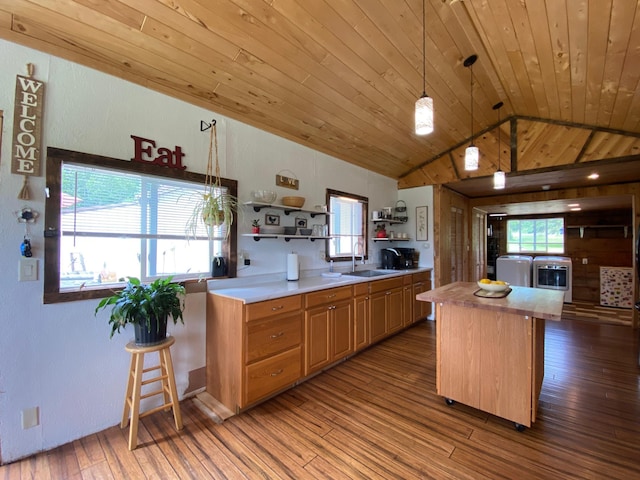3653 Front St, Barnum, MN 55707 - kitchen with lofted ceiling, open shelves, light countertops, hardwood / wood-style flooring, and a center island