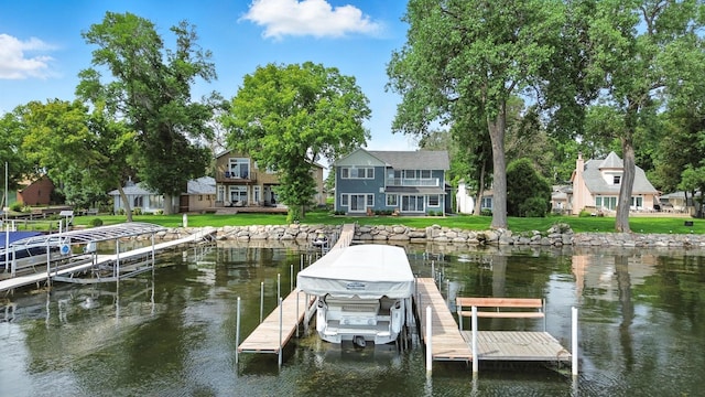 5459 Bartlett Blvd, Mound, MN 55364 - dock area featuring a water view, boat lift, and a lawn