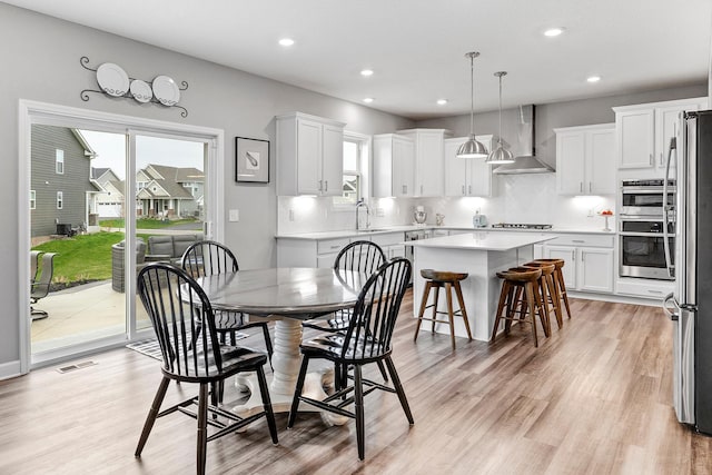 6439 Alvina Ct, Inver Grove Heights, MN 55077 - dining area with light wood finished floors and recessed lighting
