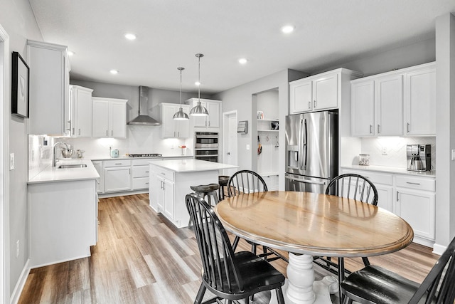 6439 Alvina Ct, Inver Grove Heights, MN 55077 - dining area with recessed lighting and light wood-style floors