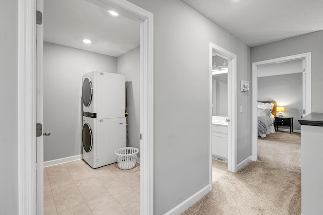 6439 Alvina Ct, Inver Grove Heights, MN 55077 - laundry area with stacked washer / dryer and baseboards