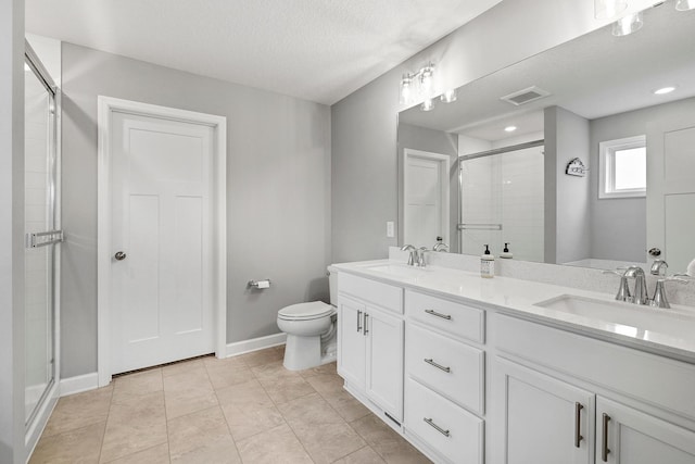6439 Alvina Ct, Inver Grove Heights, MN 55077 - bathroom featuring a stall shower, double vanity, a textured ceiling, and tile patterned flooring
