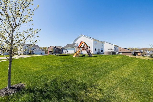 6439 Alvina Ct, Inver Grove Heights, MN 55077 - view of front facade featuring a playground, a trampoline, a residential view, and a front yard