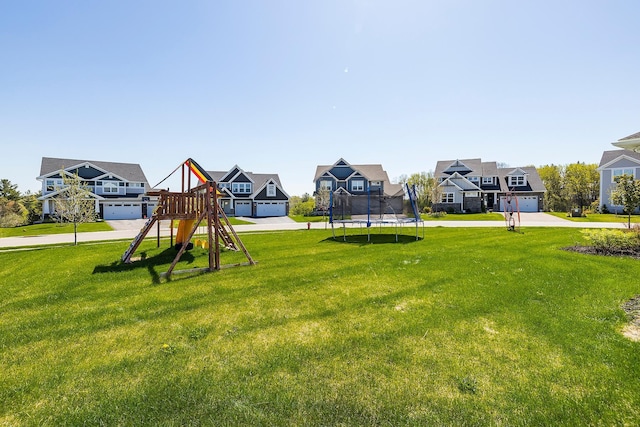 6439 Alvina Ct, Inver Grove Heights, MN 55077 - community play area featuring a residential view, a trampoline, and a lawn
