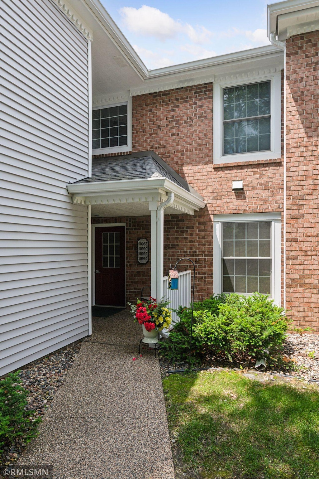 10992 Quebec Ave S, Bloomington, MN 55438 - doorway to property with brick siding