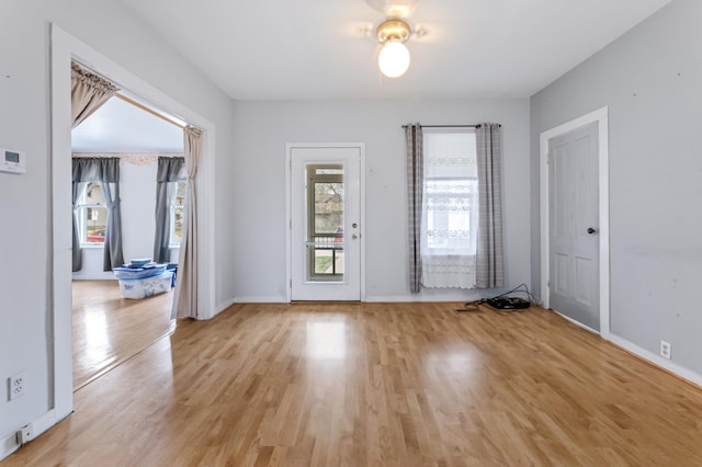 821 5th St, Winona, MN 55987 - empty room with light wood-type flooring and baseboards