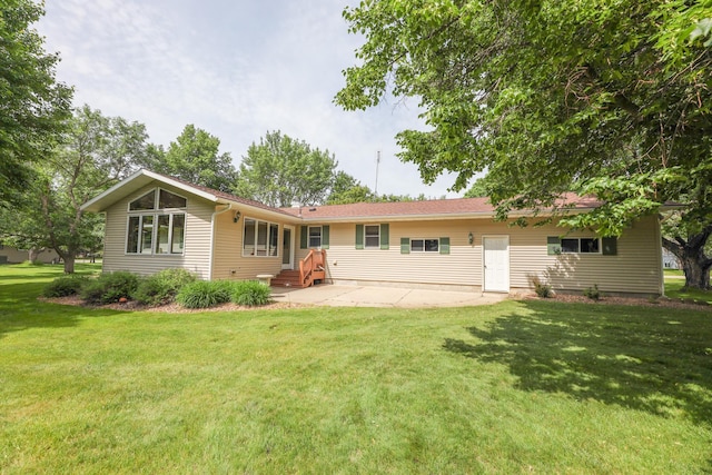 2303 Parkview Rd NE, Alexandria, MN 56308 - back of property with a lawn and a patio