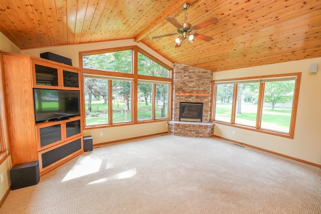 2303 Parkview Rd NE, Alexandria, MN 56308 - unfurnished living room featuring carpet floors, vaulted ceiling, wooden ceiling, a ceiling fan, and a fireplace