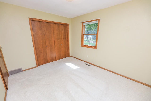 2303 Parkview Rd NE, Alexandria, MN 56308 - unfurnished bedroom featuring carpet flooring and a closet