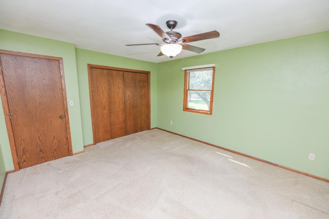 2303 Parkview Rd NE, Alexandria, MN 56308 - unfurnished bedroom featuring carpet floors, a closet, and ceiling fan