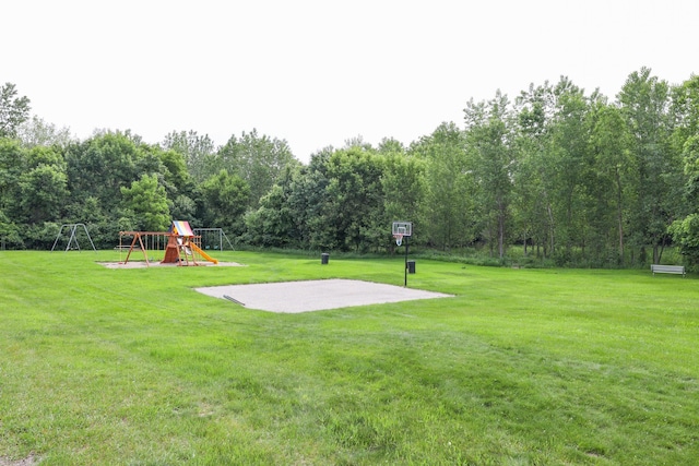 2303 Parkview Rd NE, Alexandria, MN 56308 - view of green lawn featuring a playground and basketball court