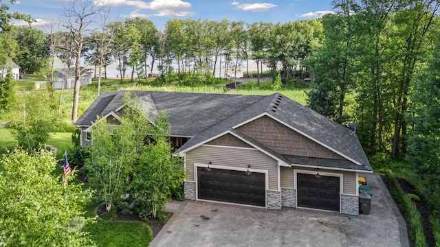 12105 285th St, Lindstrom, MN 55045 - craftsman inspired home with asphalt driveway, stone siding, roof with shingles, and an attached garage