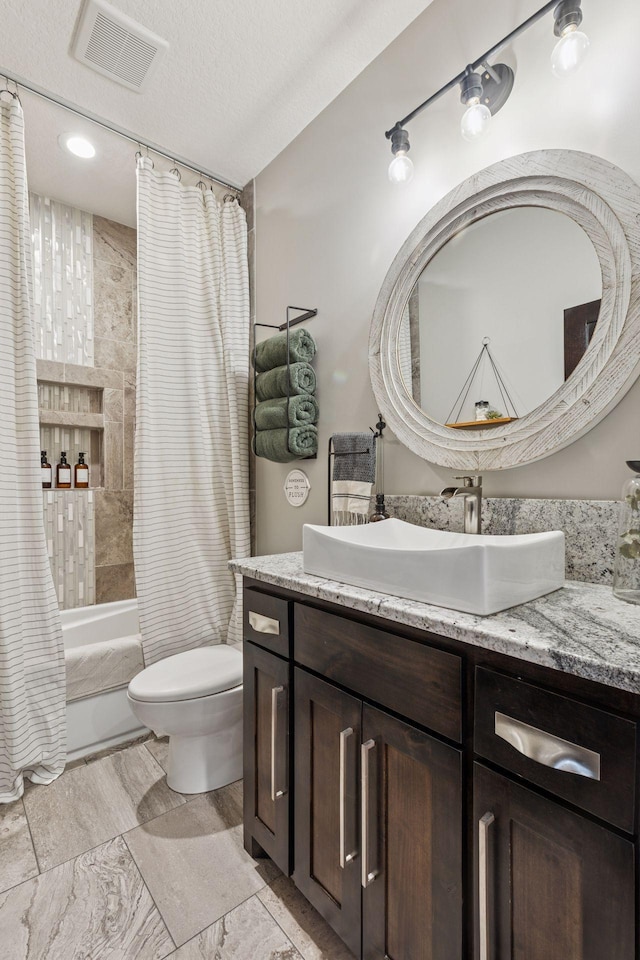 12105 285th St, Lindstrom, MN 55045 - bathroom featuring vanity, shower / tub combo, and a textured ceiling