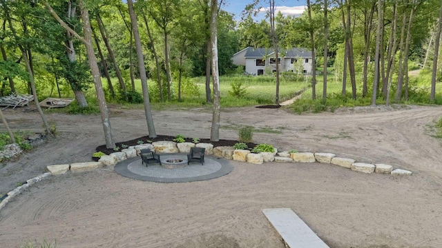 12105 285th St, Lindstrom, MN 55045 - view of yard featuring a fire pit and a patio